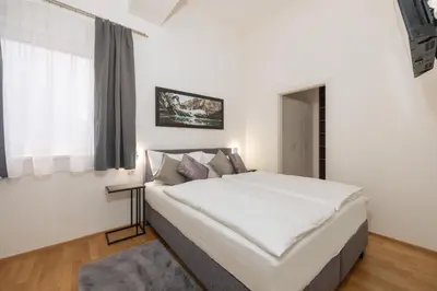 Ein Bett oder Betten in einem Zimmer der Unterkunft Appartement Tamino - City Appartement by Schladmingurlaub