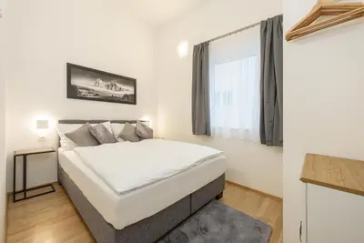 Ein Bett oder Betten in einem Zimmer der Unterkunft Appartement Tamino - City Appartement by Schladmingurlaub