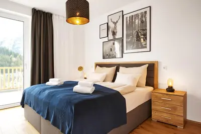 Ein Bett oder Betten in einem Zimmer der Unterkunft Adler Lodge D5