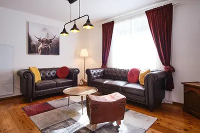 Ein Sitzbereich in der Unterkunft Appartements Das Charlie