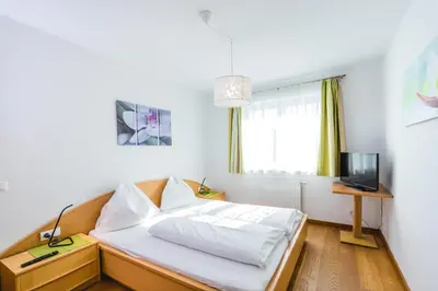 Ein Bett oder Betten in einem Zimmer der Unterkunft Brückenwirt's Ferienwohnung