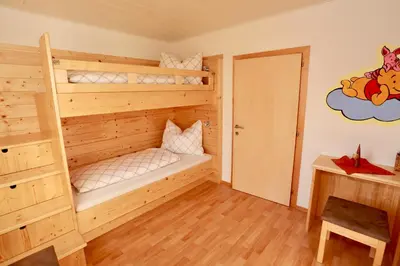 Ein Bett oder Betten in einem Zimmer der Unterkunft Zechmann-Tauernblick