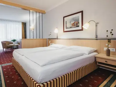 Ein Bett oder Betten in einem Zimmer der Unterkunft Sporthotel Royer