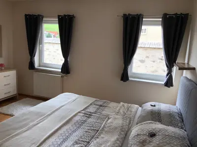 Ein Bett oder Betten in einem Zimmer der Unterkunft Ferienwohnung Stiftsgartenblick