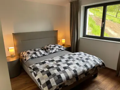 Ein Bett oder Betten in einem Zimmer der Unterkunft Modern Living Sankt Gilgen