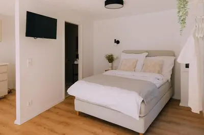 Ein Bett oder Betten in einem Zimmer der Unterkunft Bacherlhaus
