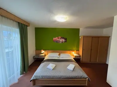 Ein Bett oder Betten in einem Zimmer der Unterkunft Apartment House Seerose self check-in