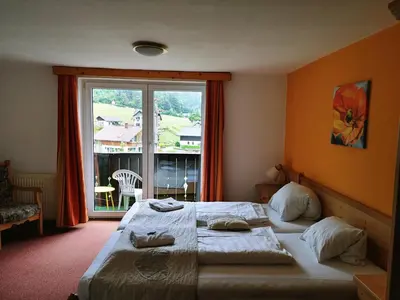 Ein Bett oder Betten in einem Zimmer der Unterkunft Apartment House Seerose self check-in