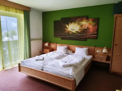 Ein Bett oder Betten in einem Zimmer der Unterkunft Apartment House Seerose self check-in