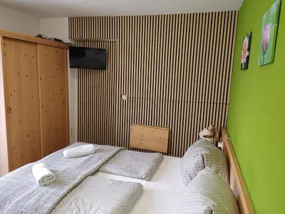 Ein Bett oder Betten in einem Zimmer der Unterkunft Apartment House Seerose self check-in
