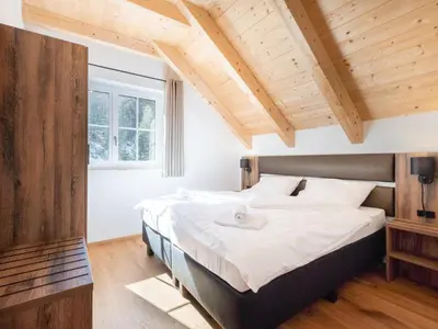 Ein Bett oder Betten in einem Zimmer der Unterkunft Riesner Alm 35