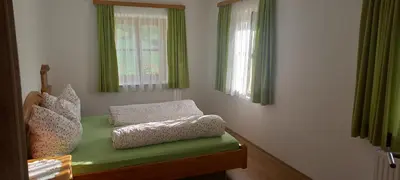 Ein Bett oder Betten in einem Zimmer der Unterkunft Eisl