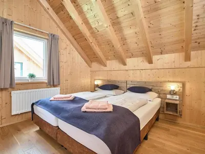 Ein Bett oder Betten in einem Zimmer der Unterkunft Mur-Chalet St Michael L