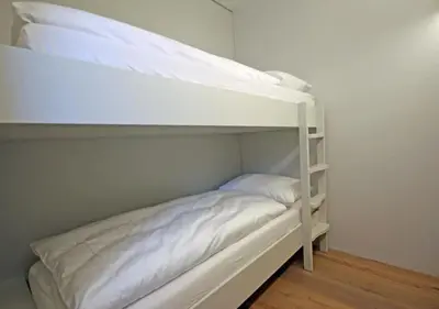 Ein Bett oder Betten in einem Zimmer der Unterkunft Exclusive Alpenlodge ski in ski out Galsterberg