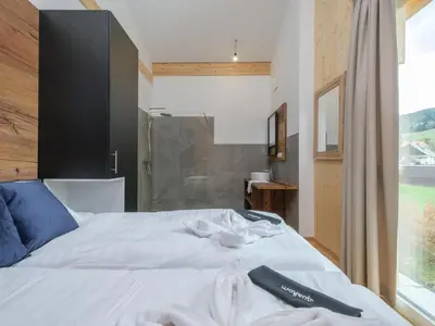 Ein Bett oder Betten in einem Zimmer der Unterkunft Aquarius Haus 7 TOP 16