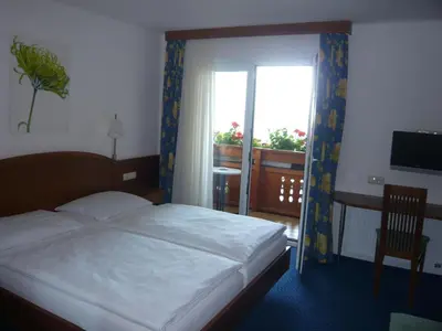 Ein Bett oder Betten in einem Zimmer der Unterkunft Frühstückspension Seeblick