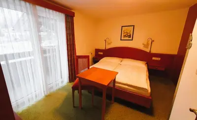 Ein Bett oder Betten in einem Zimmer der Unterkunft Frühstückspension Seeblick