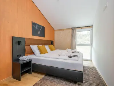Ein Bett oder Betten in einem Zimmer der Unterkunft Aquarius Haus 8 TOP 17