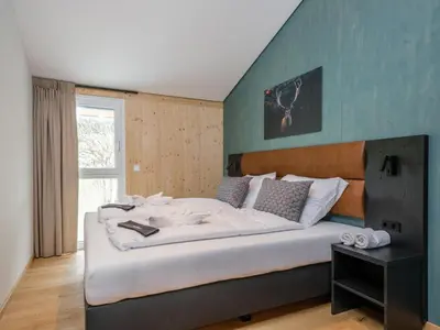 Ein Bett oder Betten in einem Zimmer der Unterkunft Aquarius Haus 8 TOP 17