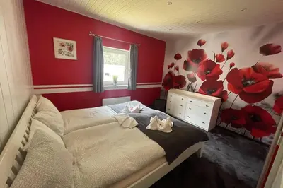 Ein Bett oder Betten in einem Zimmer der Unterkunft Murzeit Apartman
