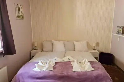 Ein Bett oder Betten in einem Zimmer der Unterkunft Murzeit Apartman