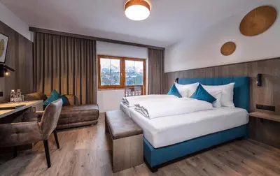 Ein Bett oder Betten in einem Zimmer der Unterkunft Der Burgfellnerhof - Adults Only