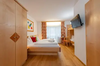 Ein Bett oder Betten in einem Zimmer der Unterkunft Hotel Gleimingerhof - Reiteralm