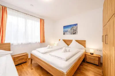 Ein Bett oder Betten in einem Zimmer der Unterkunft Appartement Franz Josef - by myNests
