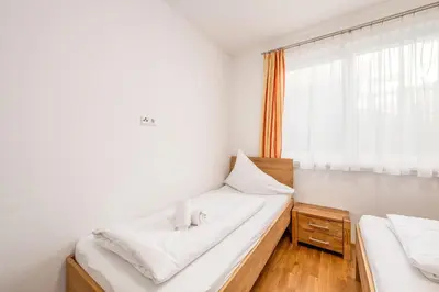 Ein Bett oder Betten in einem Zimmer der Unterkunft Appartement Franz Josef - by myNests