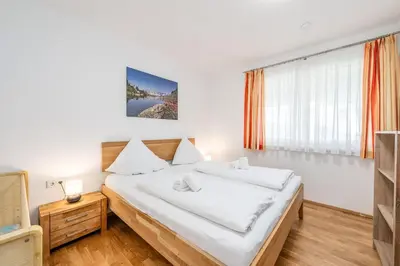 Ein Bett oder Betten in einem Zimmer der Unterkunft Appartement Franz Josef - by myNests