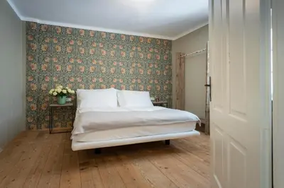 Ein Bett oder Betten in einem Zimmer der Unterkunft Braumeisterhaus Schloss Eggenberg