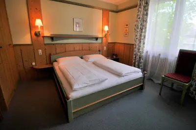 Ein Bett oder Betten in einem Zimmer der Unterkunft Landgasthof Kirchenwirt