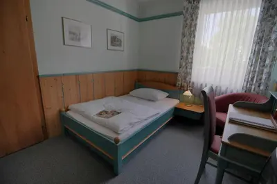 Ein Bett oder Betten in einem Zimmer der Unterkunft Landgasthof Kirchenwirt