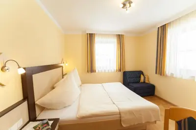 Ein Bett oder Betten in einem Zimmer der Unterkunft Appartements Höller