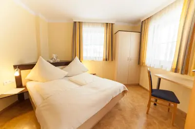 Ein Bett oder Betten in einem Zimmer der Unterkunft Appartements Höller