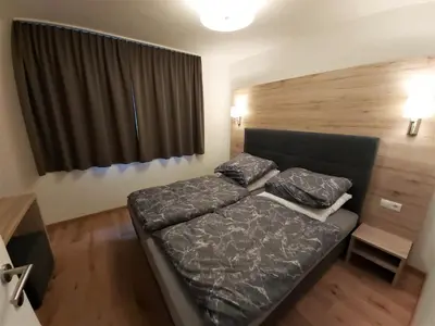 Ein Bett oder Betten in einem Zimmer der Unterkunft Gleiming apartments