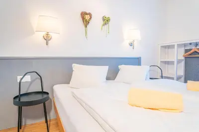 Ein Bett oder Betten in einem Zimmer der Unterkunft alpsrental Apartments Freja Obertauern