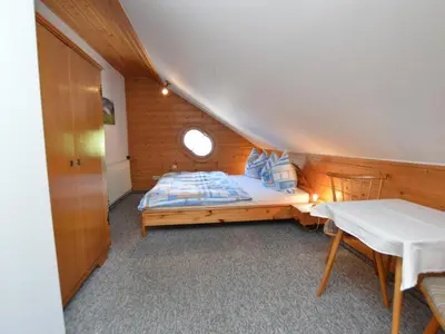 Ein Bett oder Betten in einem Zimmer der Unterkunft Illusion