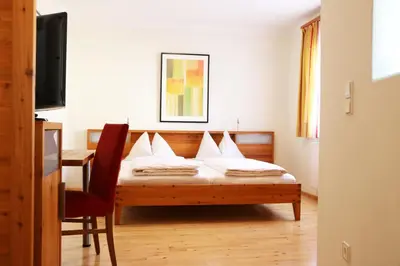 Ein Bett oder Betten in einem Zimmer der Unterkunft Hotel Binggl