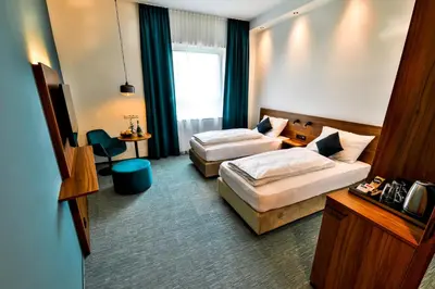 Ein Bett oder Betten in einem Zimmer der Unterkunft Hotel Das Zeit
