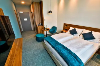Ein Bett oder Betten in einem Zimmer der Unterkunft Hotel Das Zeit