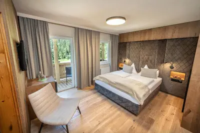 Ein Bett oder Betten in einem Zimmer der Unterkunft Lürzerhof - luxury nature spa