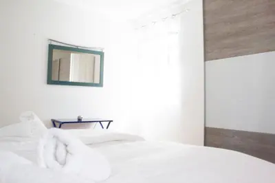 Ein Bett oder Betten in einem Zimmer der Unterkunft Royal 4 Trend by Alpenidyll Apartments