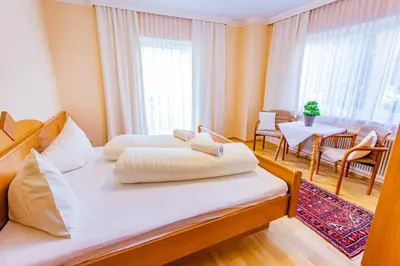 Ein Bett oder Betten in einem Zimmer der Unterkunft Soldanella 2 by Alpenidyll Apartments