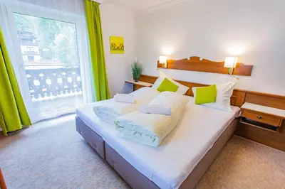 Ein Bett oder Betten in einem Zimmer der Unterkunft Soldanella 4 by Alpenidyll Apartments