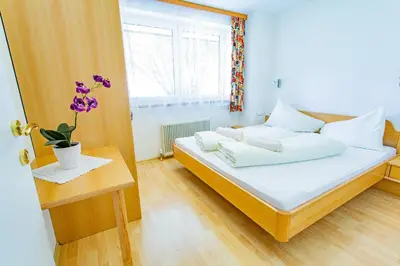 Ein Bett oder Betten in einem Zimmer der Unterkunft Soldanella 8 by Alpenidyll Apartments