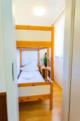 Ein Bett oder Betten in einem Zimmer der Unterkunft Soldanella 8 by Alpenidyll Apartments