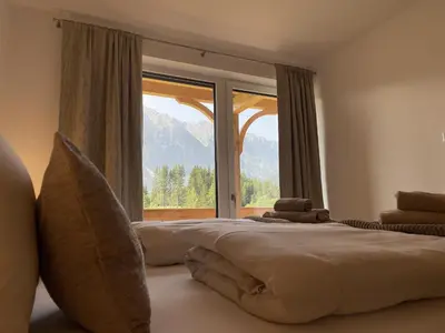 Ein Bett oder Betten in einem Zimmer der Unterkunft Panorama Lodge Mountainview 208