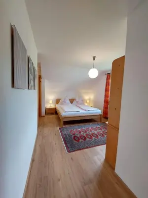 Ein Bett oder Betten in einem Zimmer der Unterkunft Lovely house with mountain view & big garden in Bad Aussee