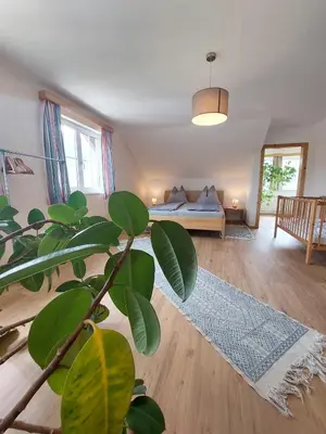Ein Bett oder Betten in einem Zimmer der Unterkunft Lovely house with mountain view & big garden in Bad Aussee